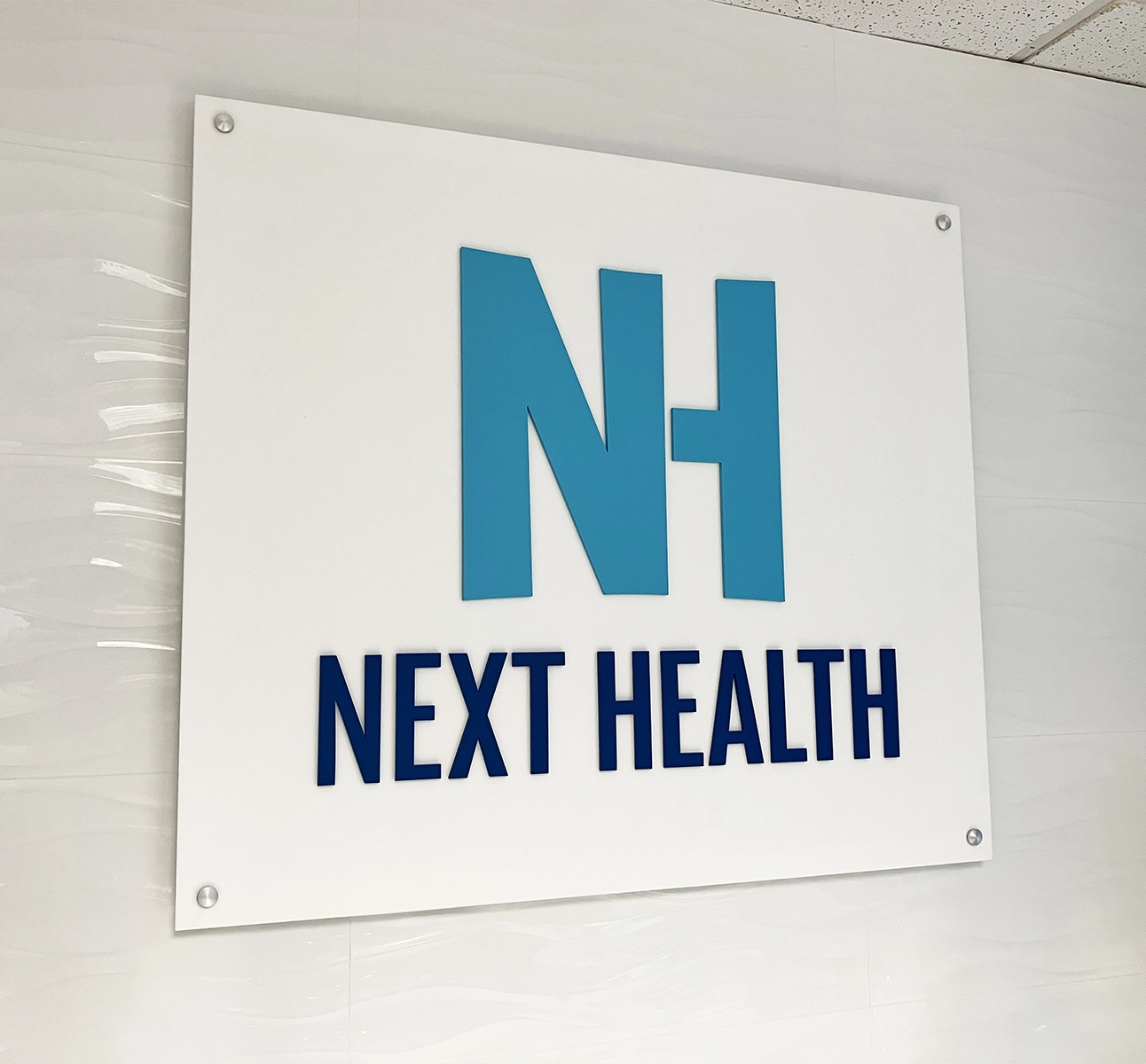 The Next Health sign in the lobby